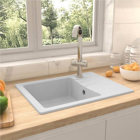 Kitchen sink with oval white granite overflow hole